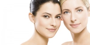 studio portrait of two young beautiful women